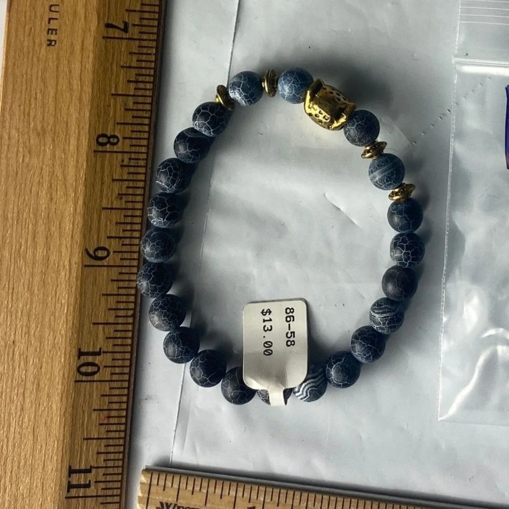 Blue Beaded Stretch Bracelet with Gold tone Buddha Charm